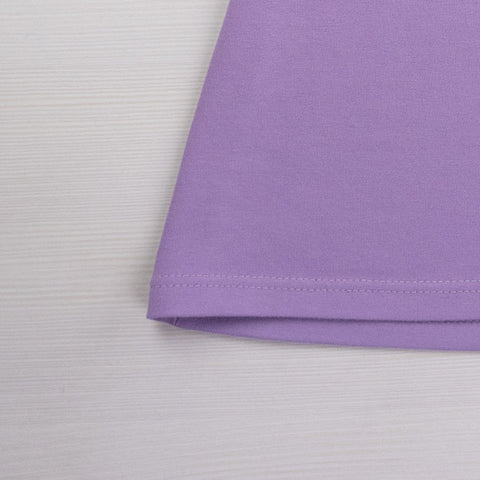 Flat lay close up of bottom tee shirt corner with twin needle stitching