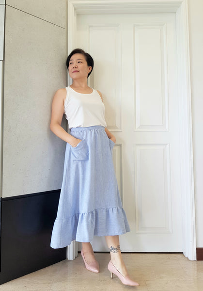 Forget-Me-Not Ella skirt pattern make, by Boon Kuan in bue with rounded patch pockets