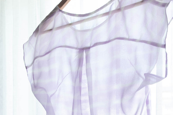 Sheer chiffon blouse in window