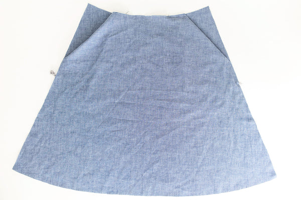 Skirt showing slash pocket sewing tutorial with pressed and unpressed pocket