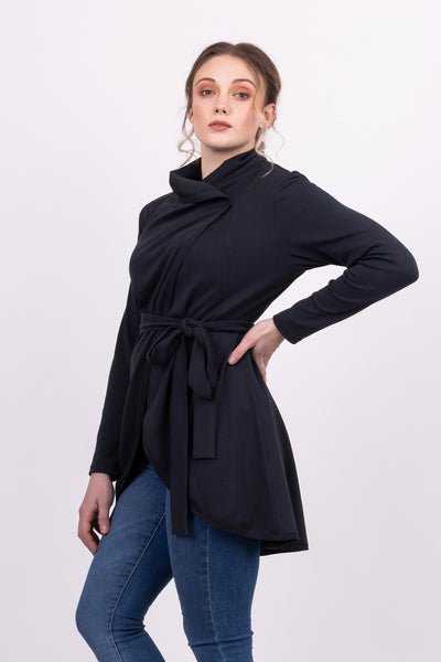 Long Kirsi cardigan in navy, worn closed, with blue jeans, side view close up