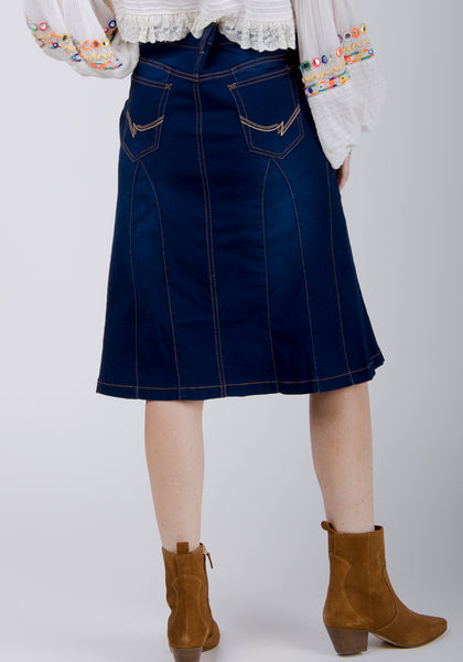 Rear view of 'Kim' brand indigo denim knee-length skirt.