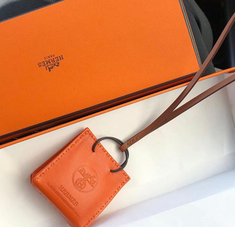 HERMES Orange Shopping Bag Charm Feu/ Gold *New - Timeless Luxuries