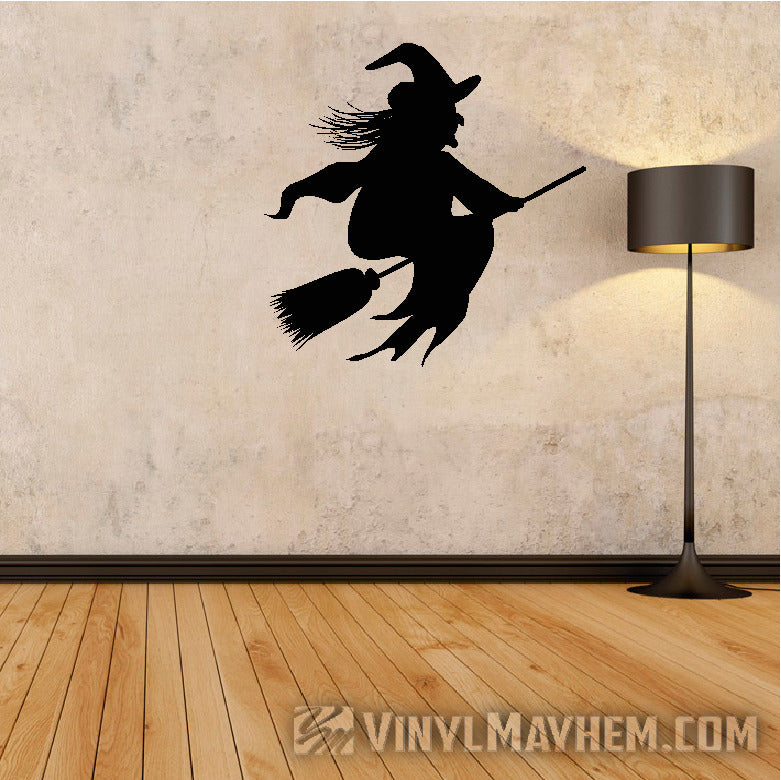 halloween witch riding broom