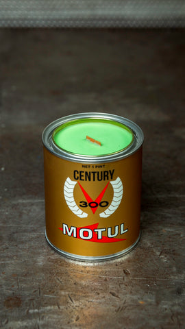 Motul 300V candle in gold metallic container, neon green wax, wooden wick