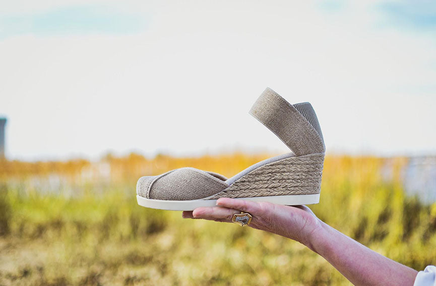 tan espadrille in hand