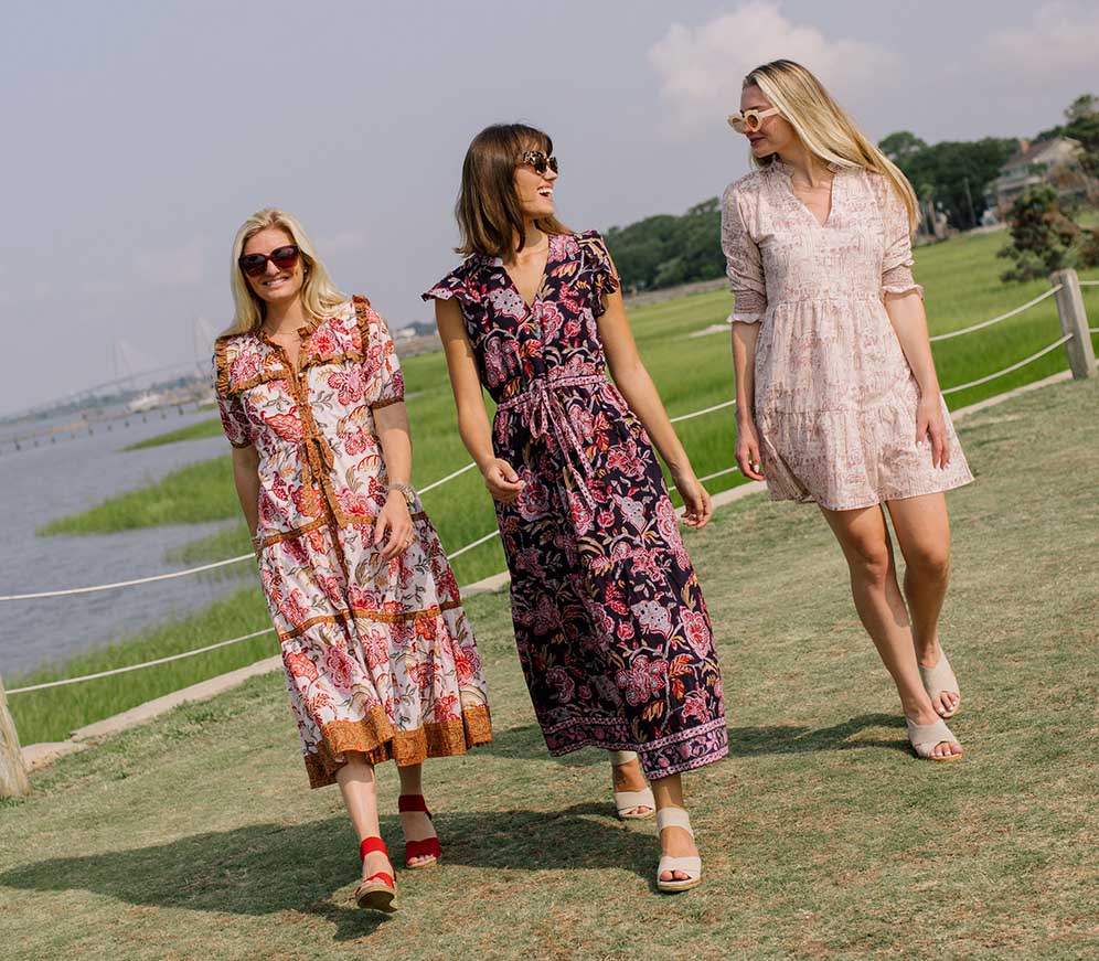 women walking in grass