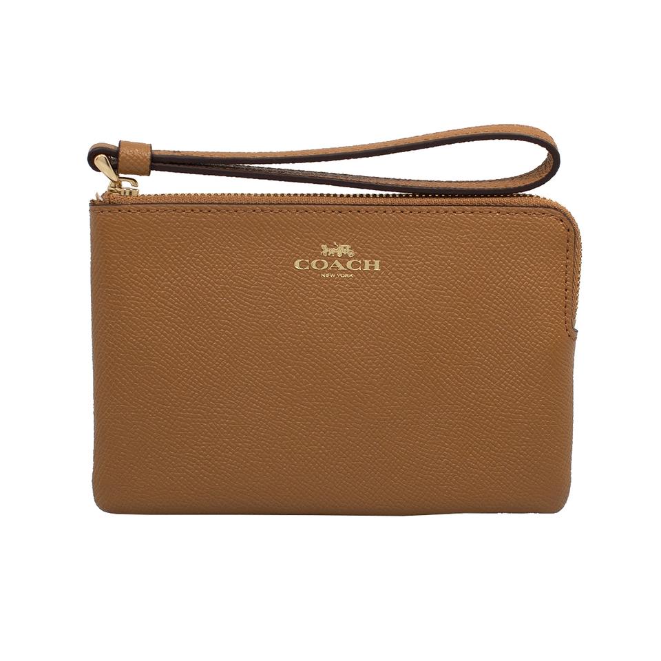 coach saddle wristlet