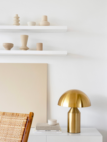 Gold mushroom lamp in a neutral modern living room