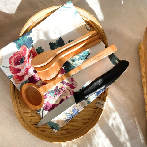 Wooden spoons on bamboo tray