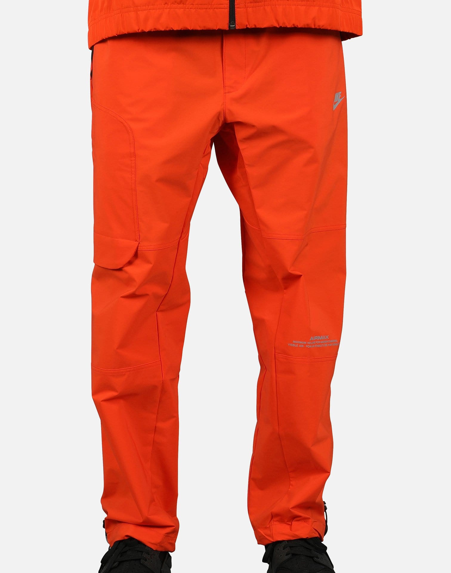 nike track pants orange