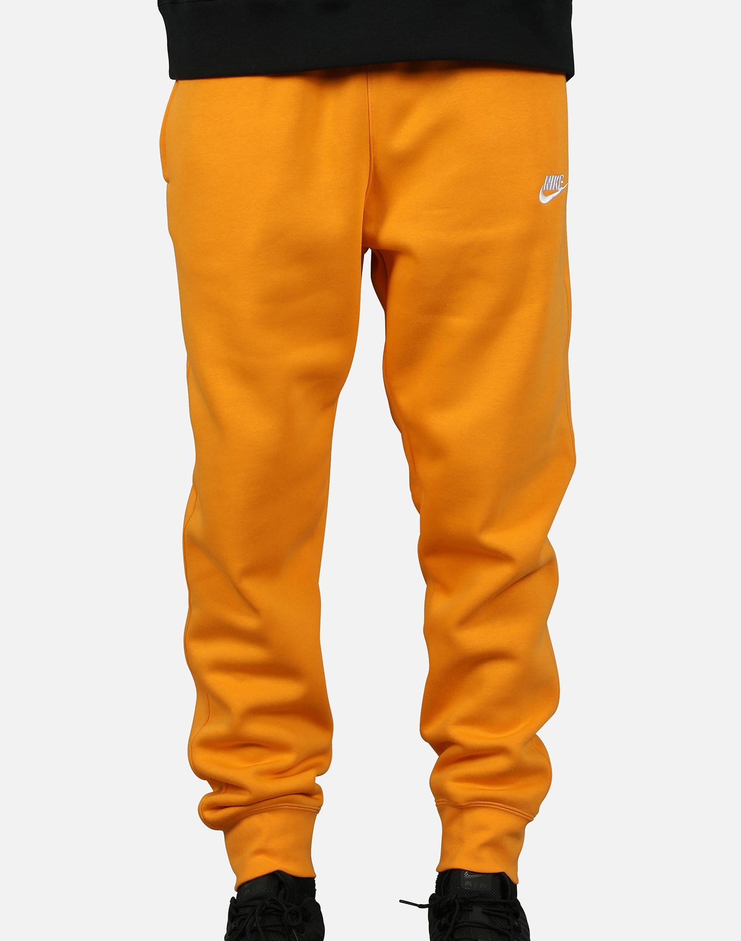 orange and black nike joggers