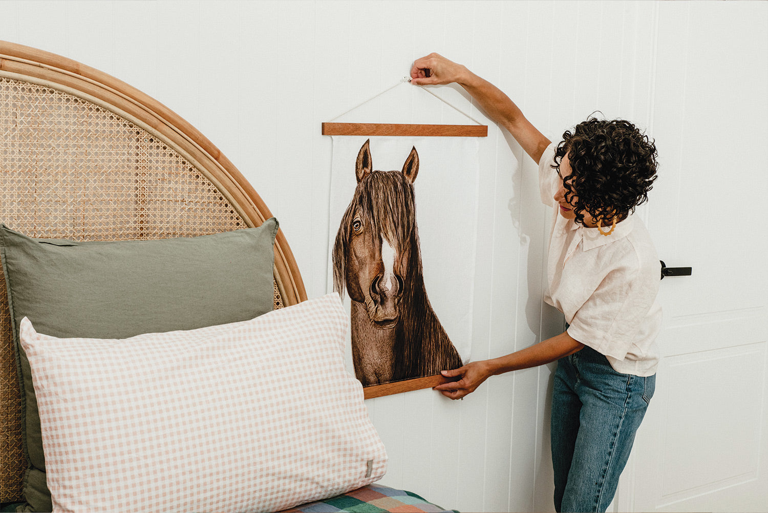 Dee hanging horse linen tea towel as art in styled bedroom