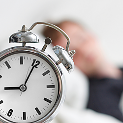 Image of old, metal alarm clock.