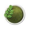 Top view image of moringa powder in a white bowl.