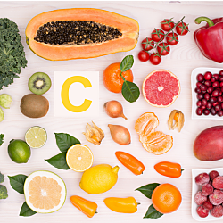 Top view of fruits and vegetables containing vitamin C.