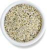 Image of hulled hemp seeds in a white bowl.