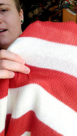 A red and white sweater stripe knit