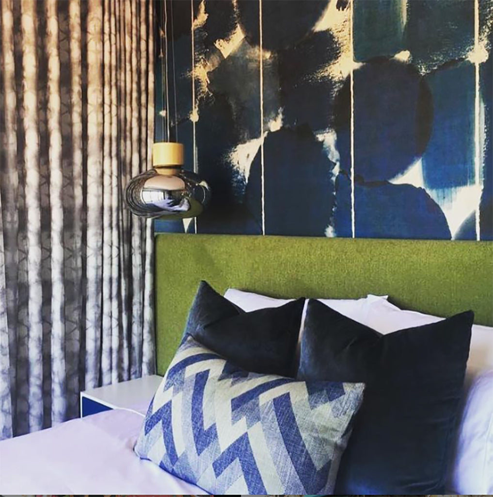 Blue pattern wallpaper in a bedroom created by interior design company