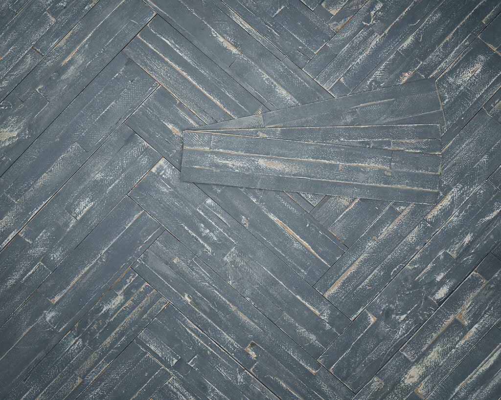 Blue wooden wall installed in a herringbone pattern