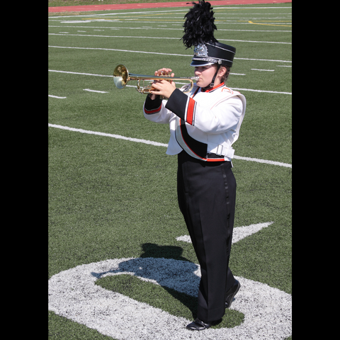 trumpet lesson student in marching band uniform
