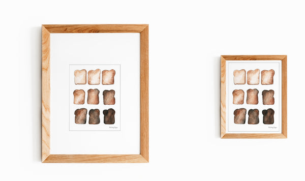 Two framed and matted illustrations of toast