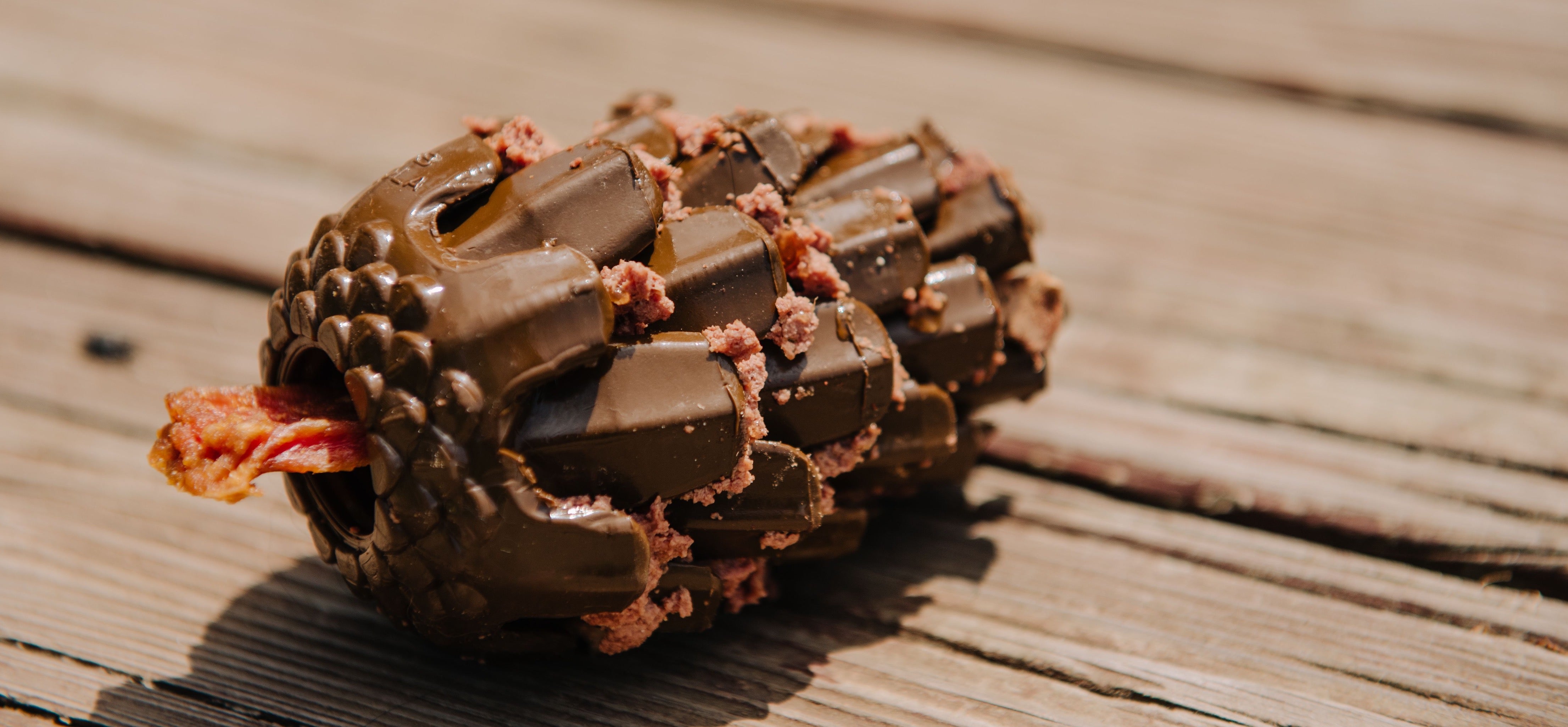 The Loblolly Pinecone Dog Toy stuffed with dog food and treats