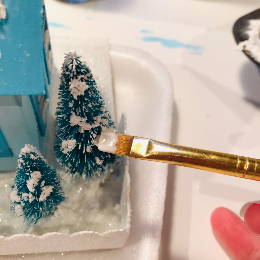 DIY Craft Tutorial - Christmas Village Putz Glitter House - Simple Cottage - Apply Mod Podge and glitter to snow on sisal trees