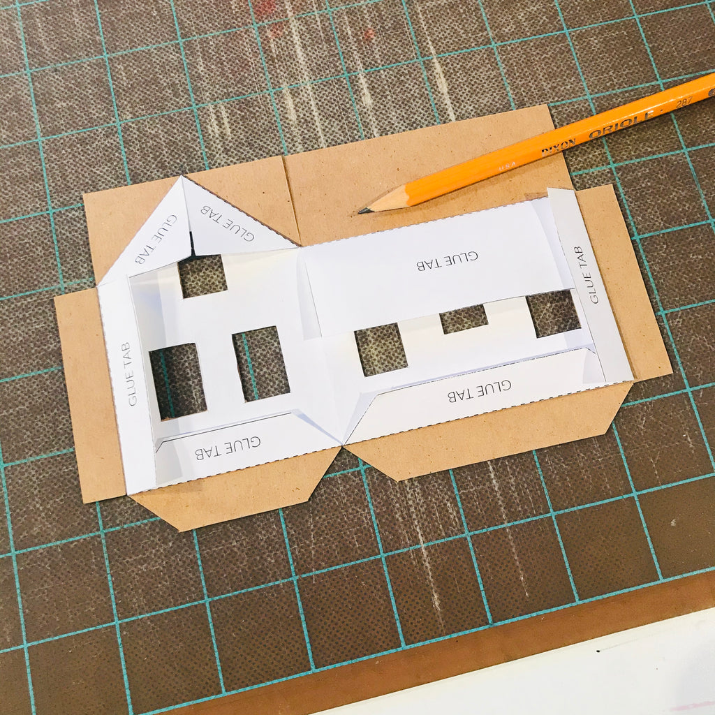 DIY Craft Tutorial - Christmas Village Putz Glitter House - Simple Cottage - Fold paper template - Place on back of cardboard piece - Trace fold lines with pencil