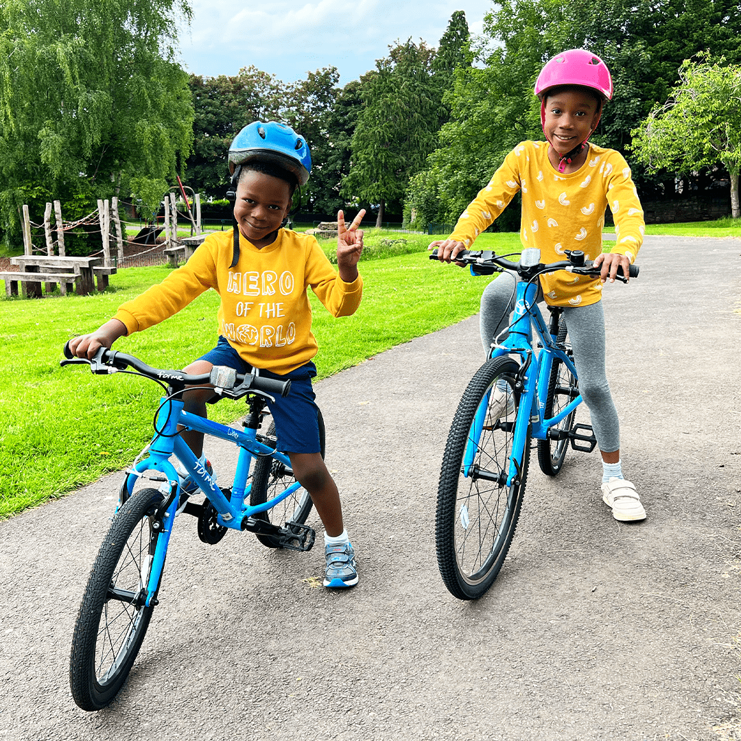 two kids on blue bikes - bike club