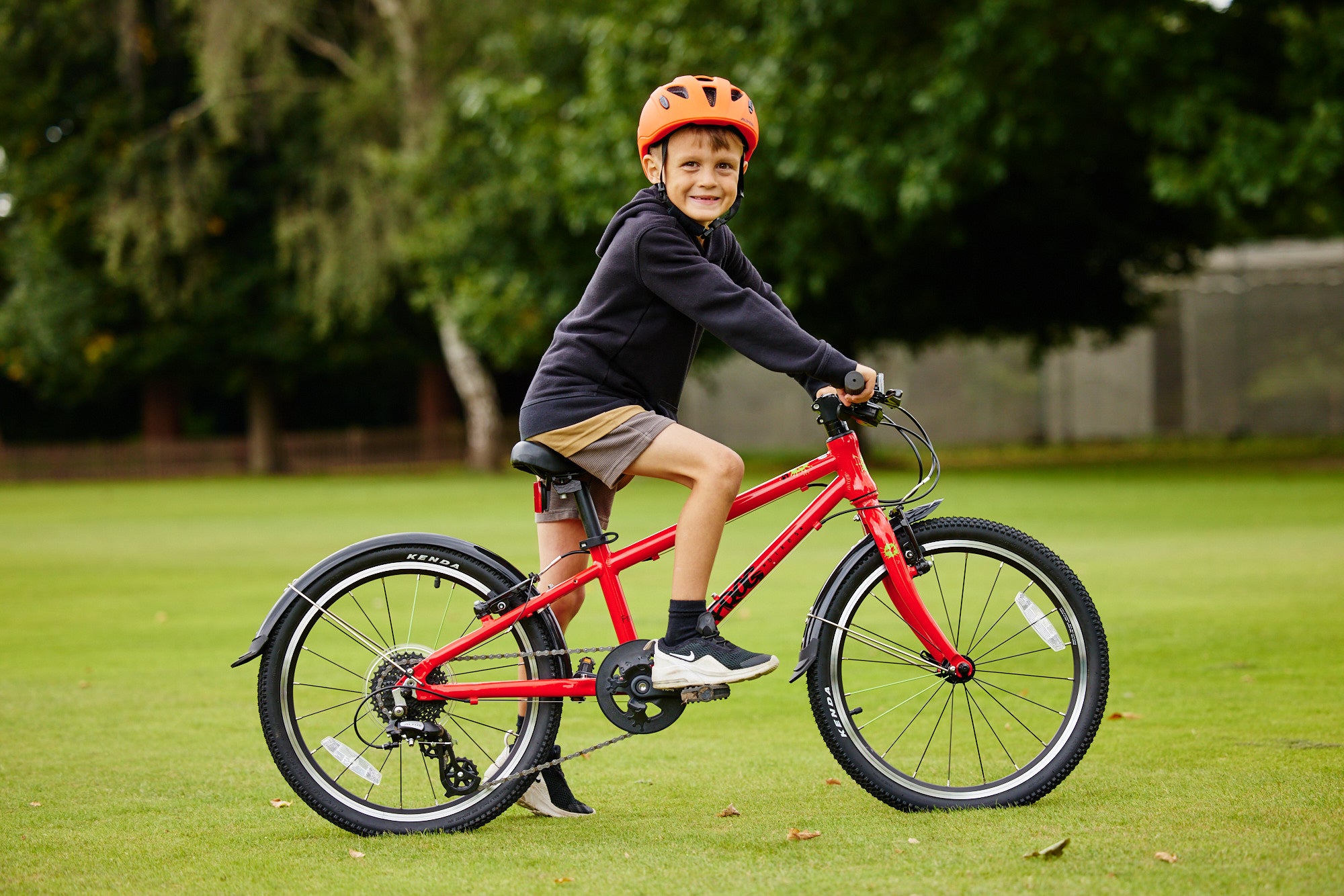 child on bike with helmet