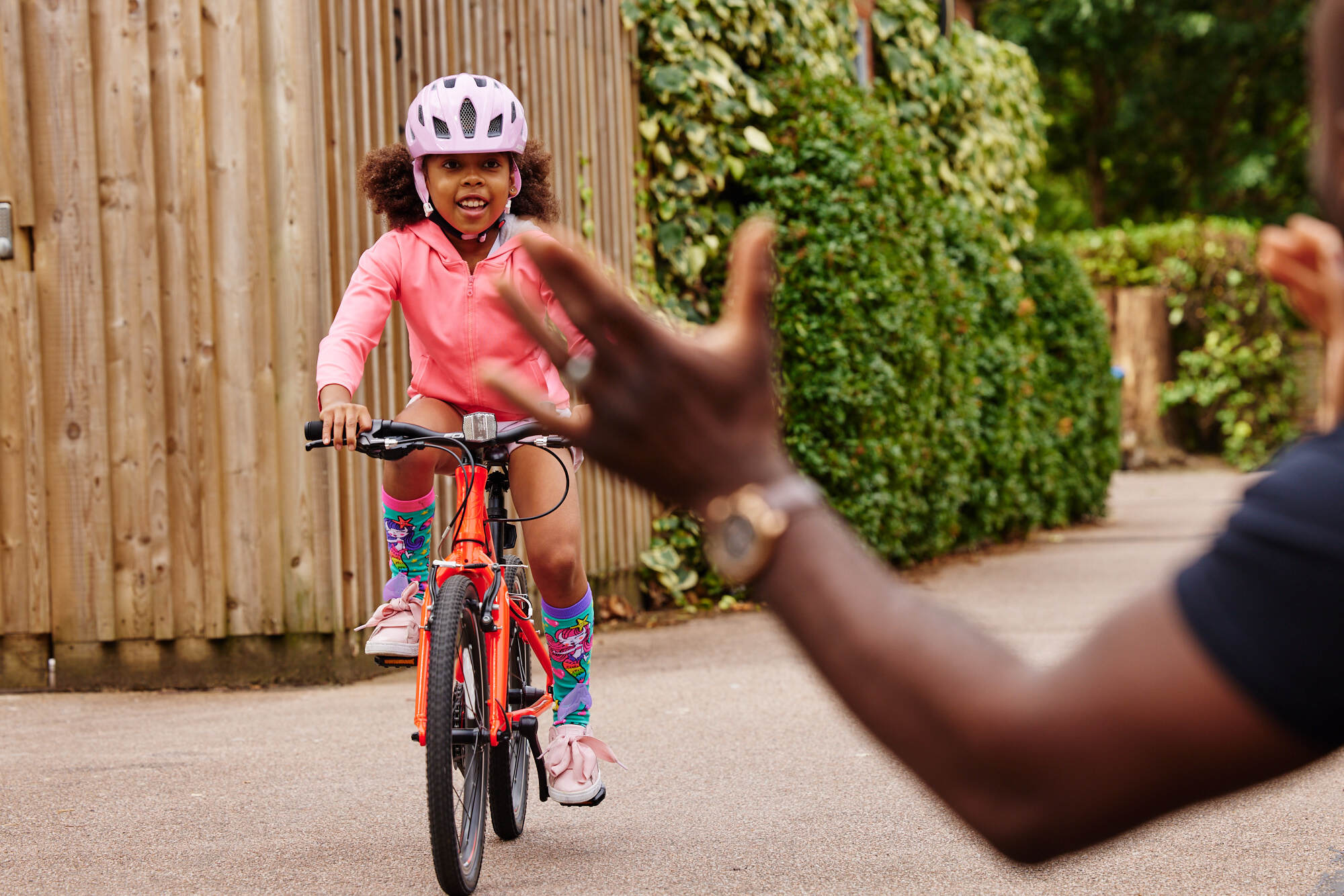 girl riding orange bike - bike club