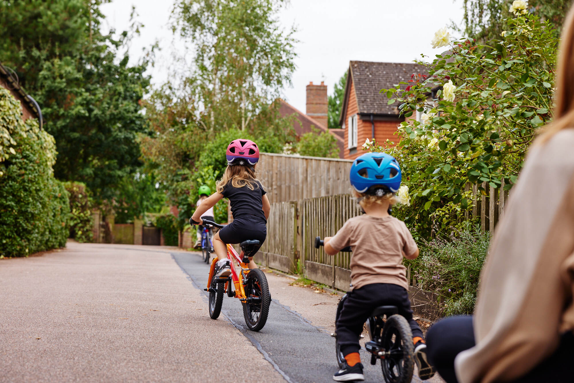 two kids riding in a line - bike club