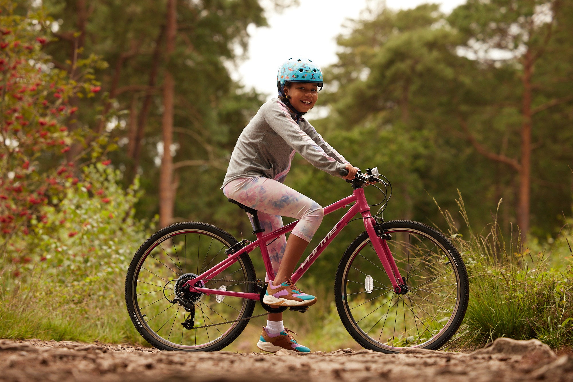 young girl riding a bike in the outdoors