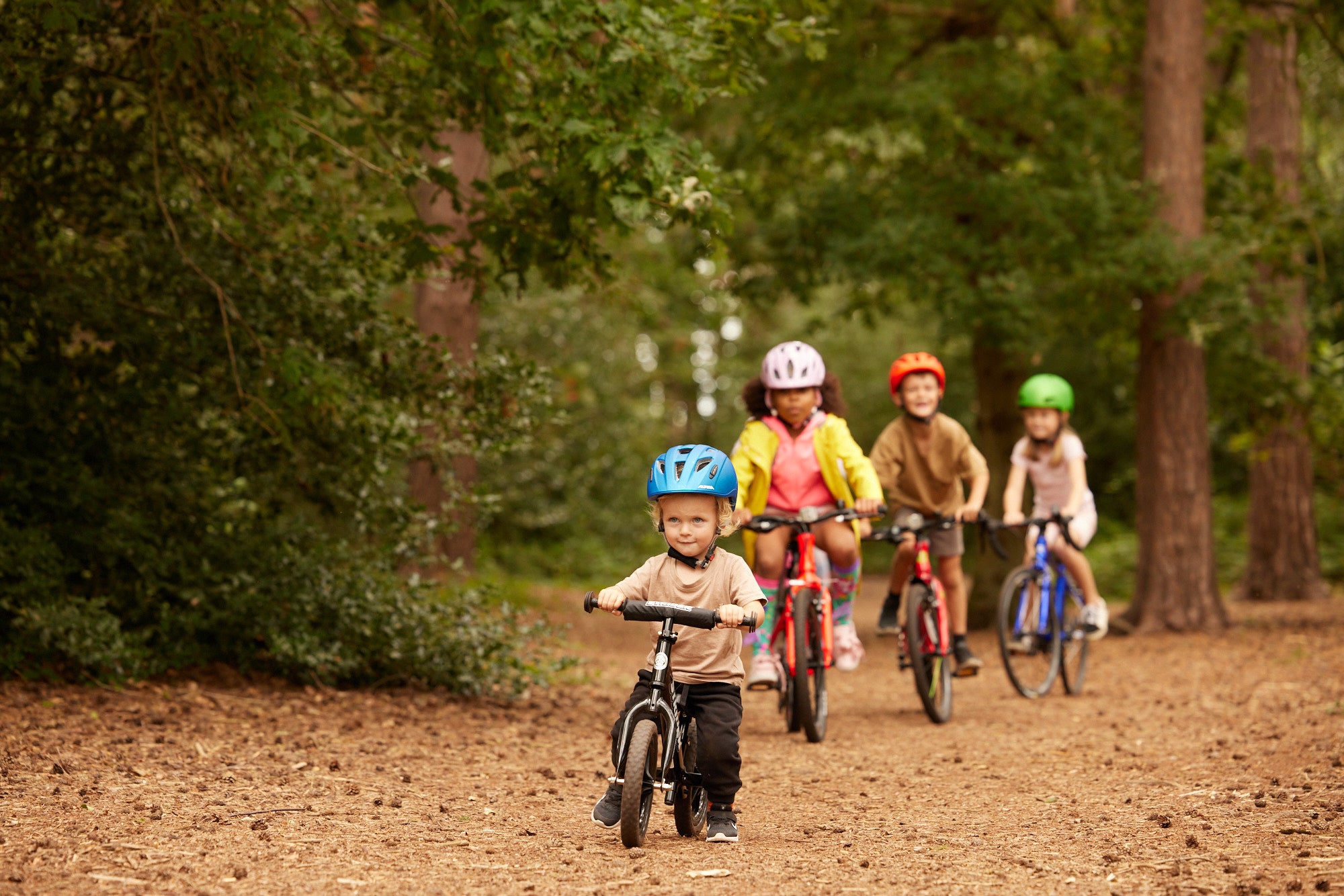 children riding in a line on bikes - Bike Club