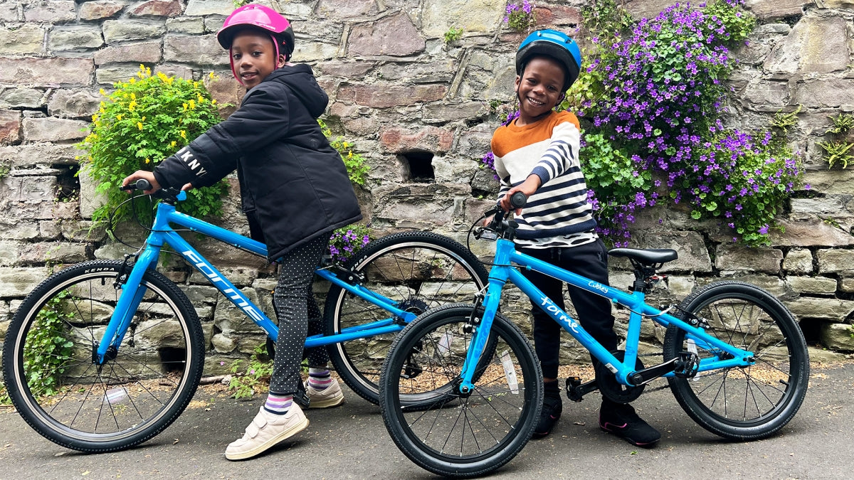 two kids with blue forme bikes - bike club