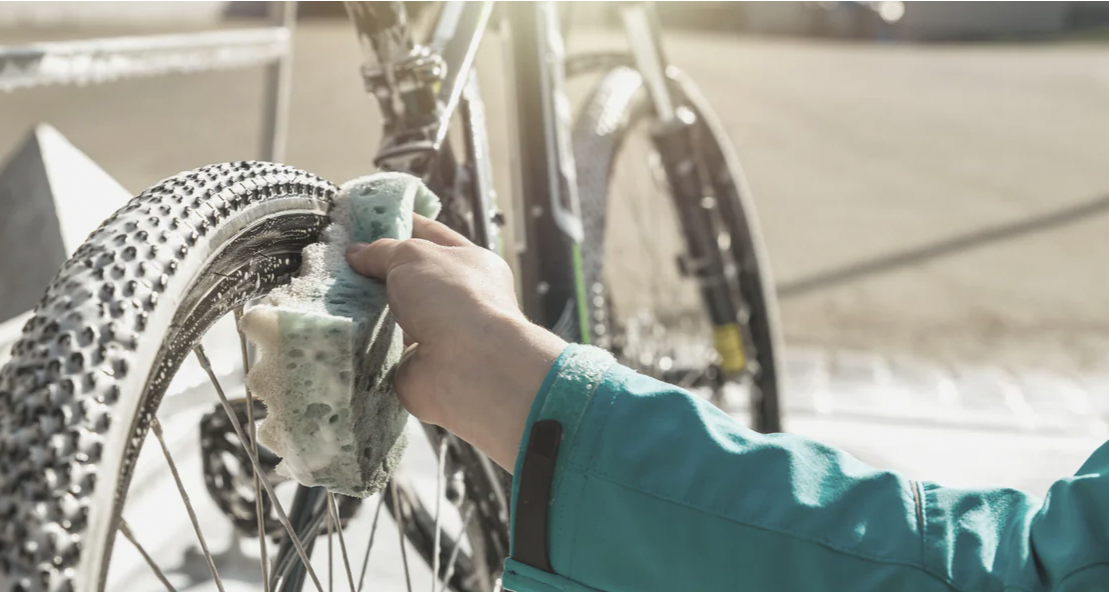 woman washing a bike