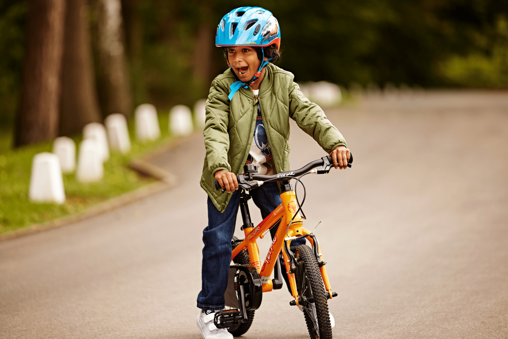 Child in road on a bike - Bike Club