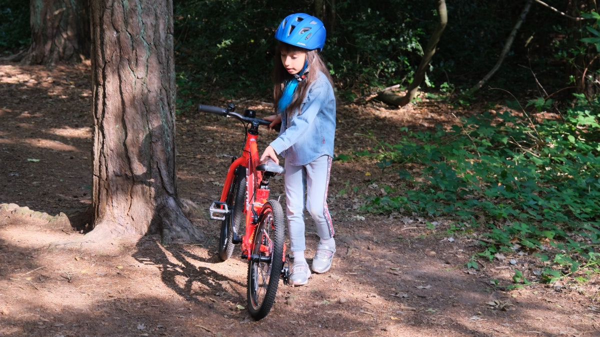 girl on a red bike