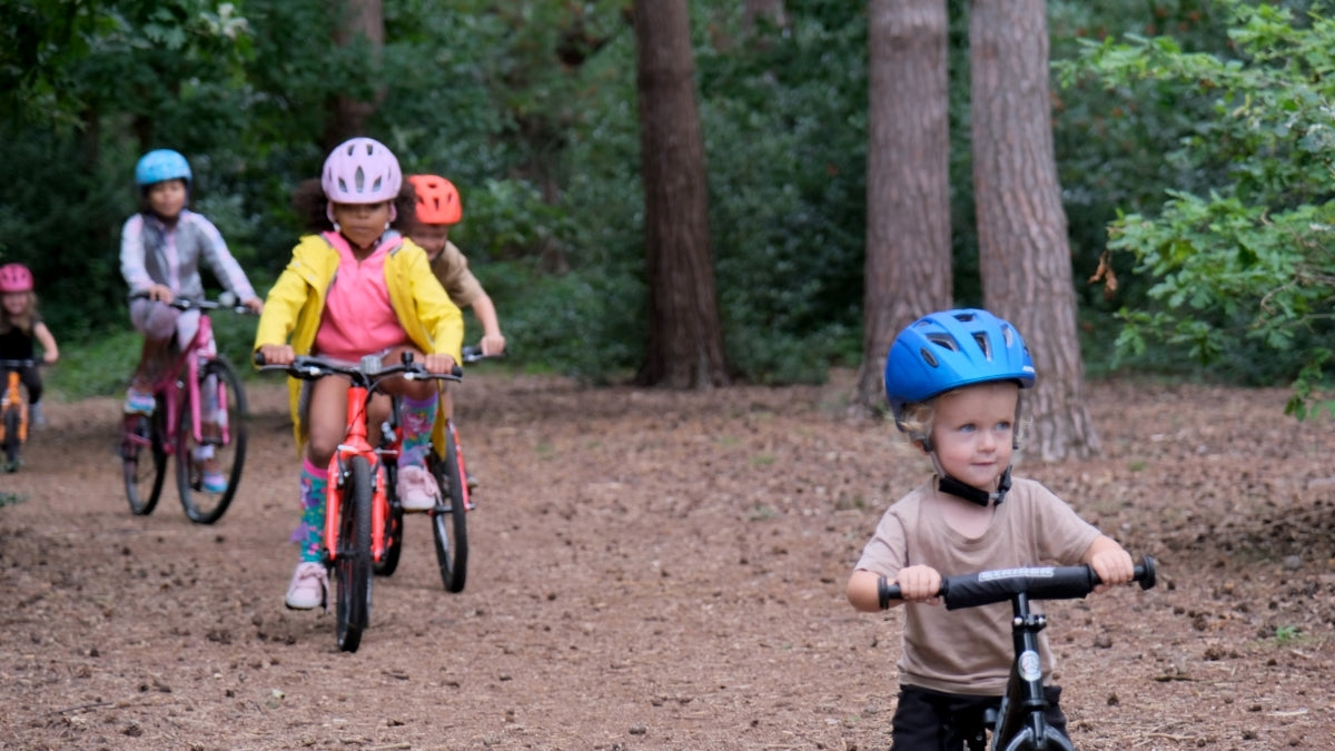 group of kids riding a bike