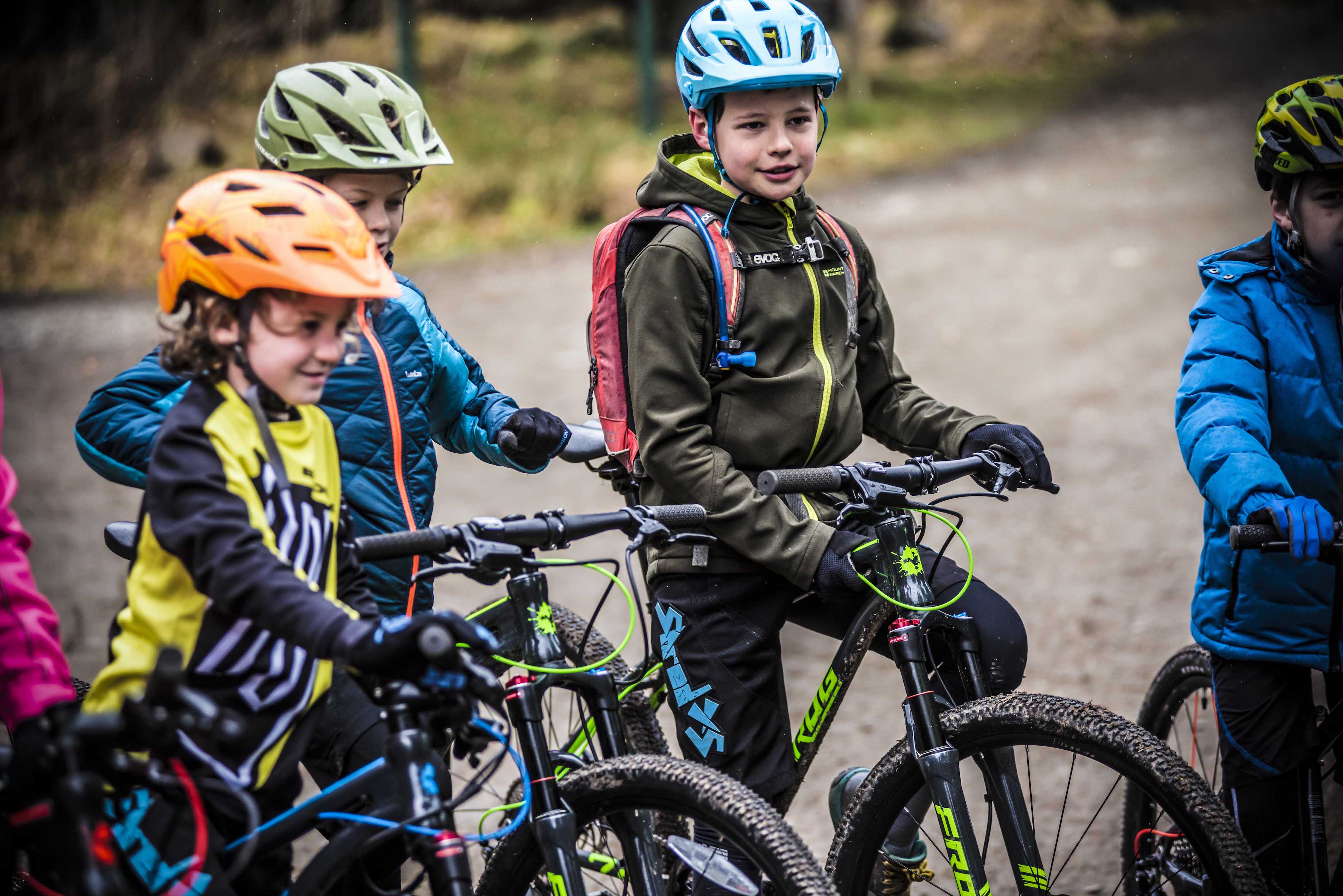 kids riding bikes in rain