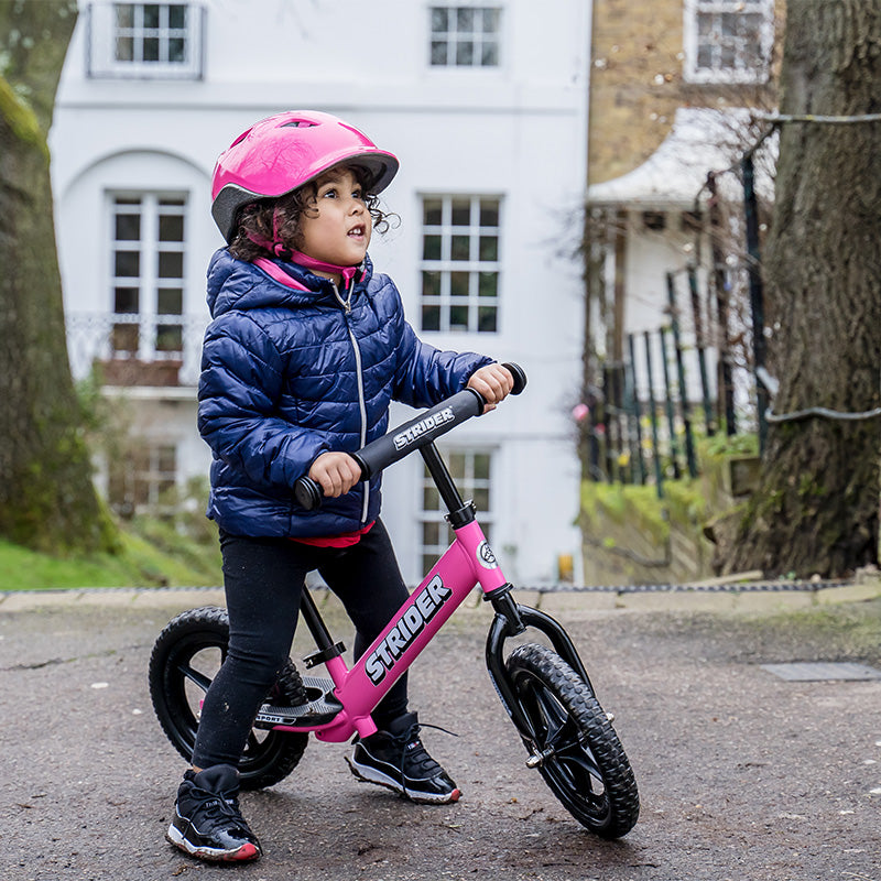 girl on strider bike