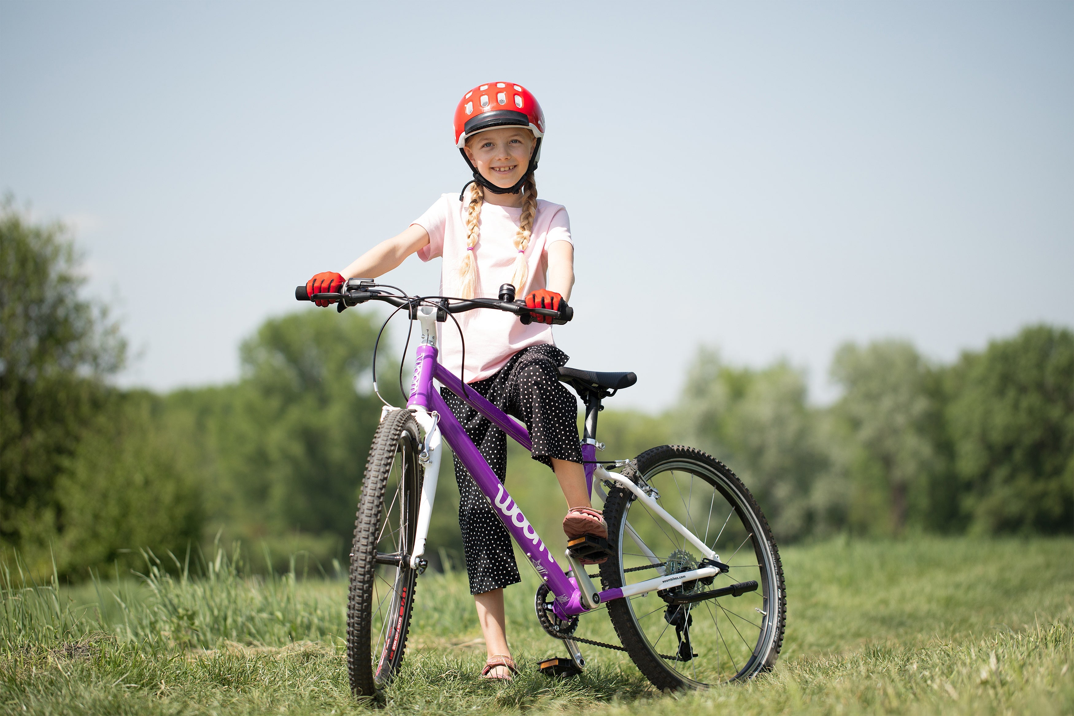 girl on woom bike - bike club