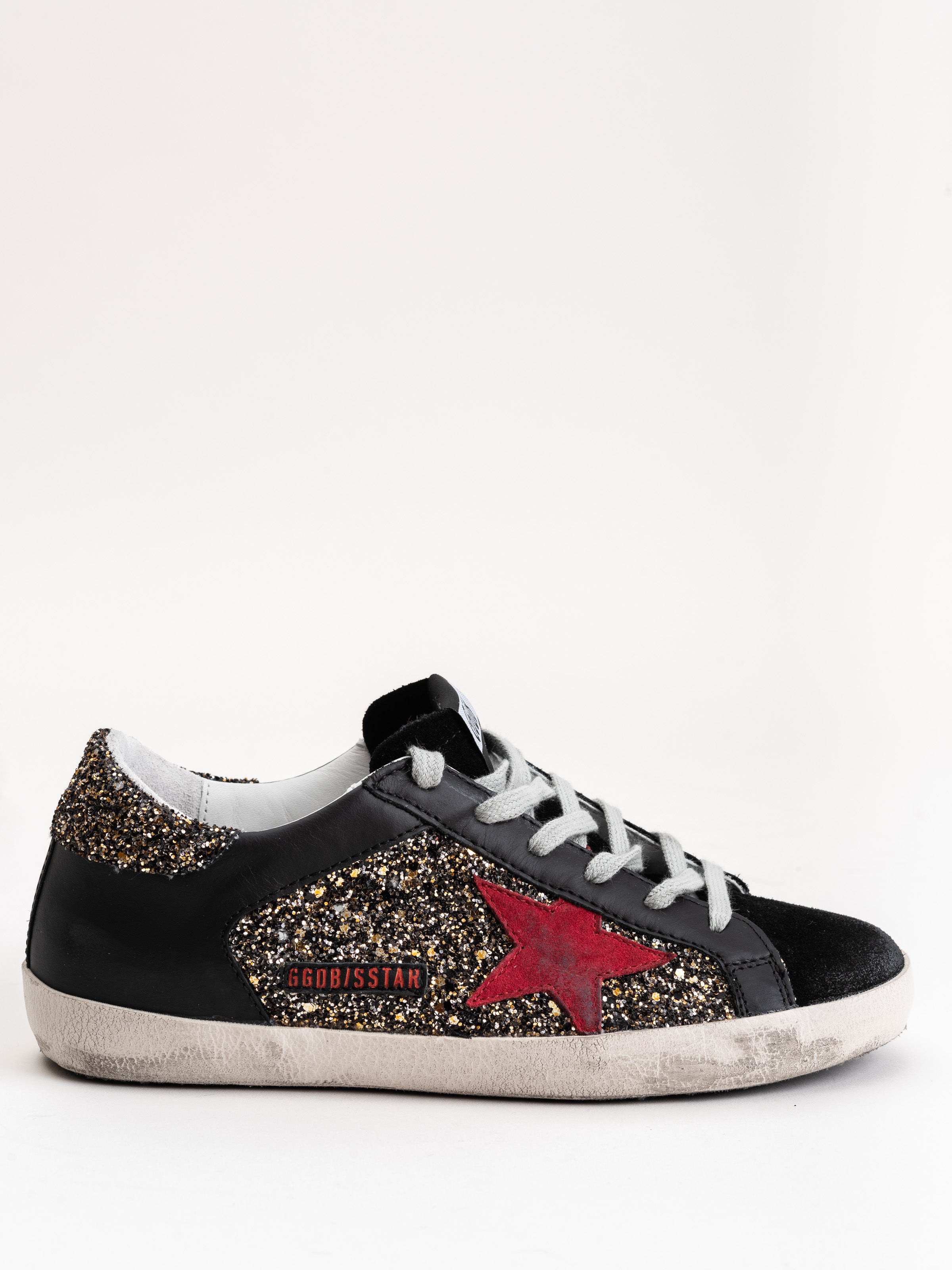 gold and silver golden goose sneakers