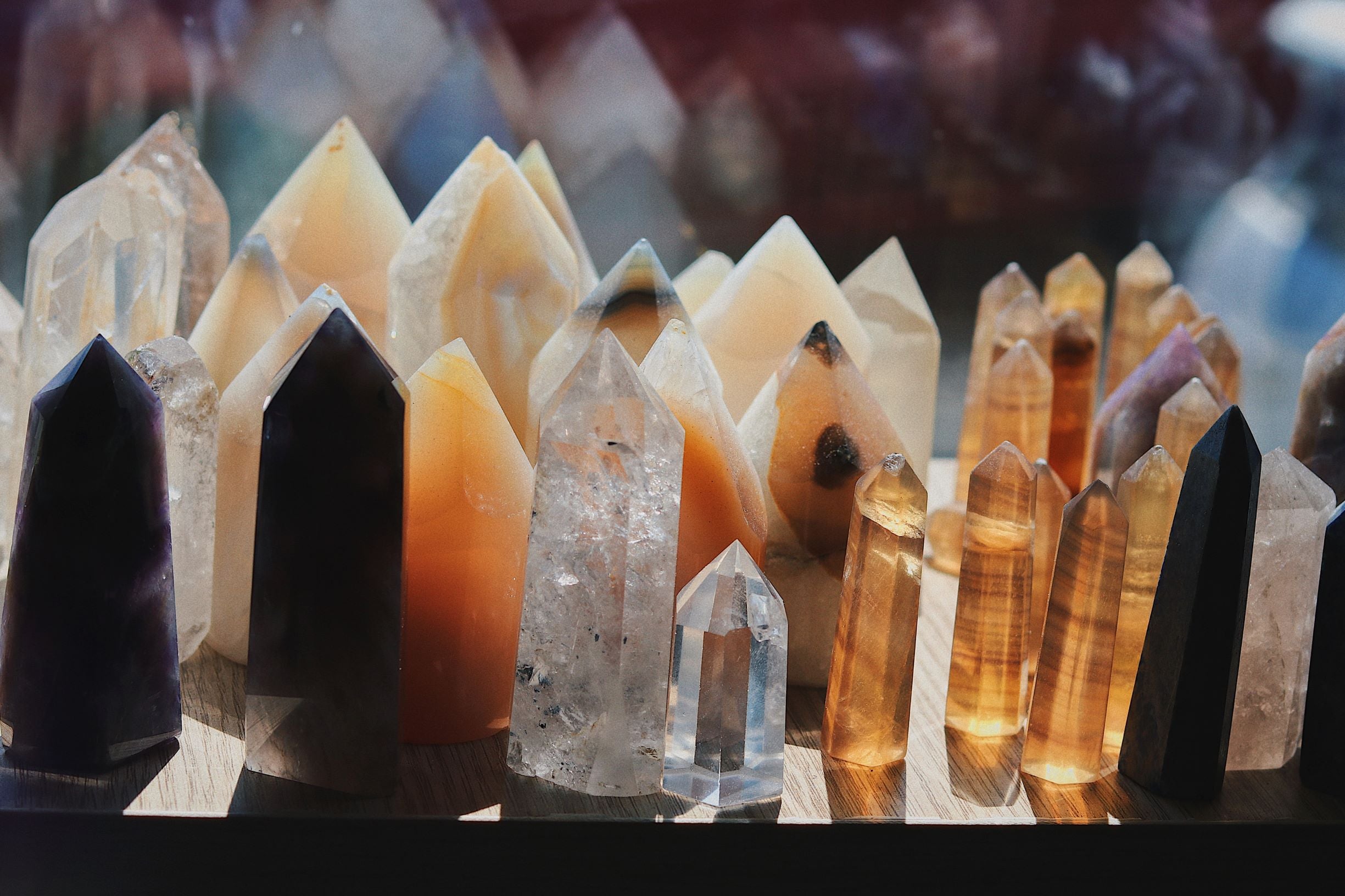 A collected of pointed crystals charging in the sunlight of a windowsill. 