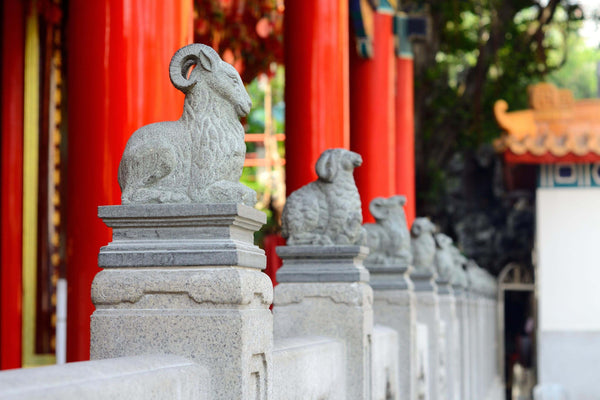 Stone goats designed to protect a Chinese temple entrance