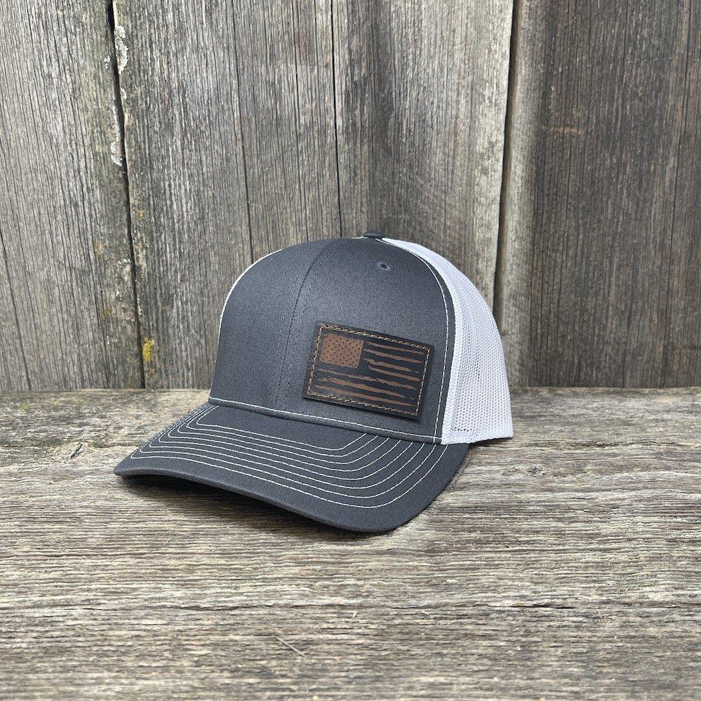 Black distressed hat with upcycled LV patch