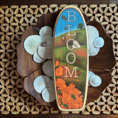 super bloom california illustration on a mini wooden surfboard