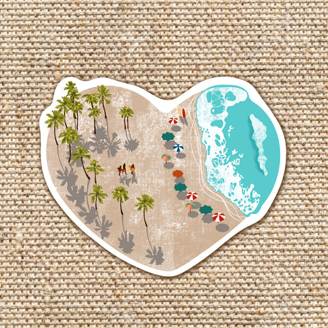 heart shaped sticker with beach scene of palm trees sand waves surfers