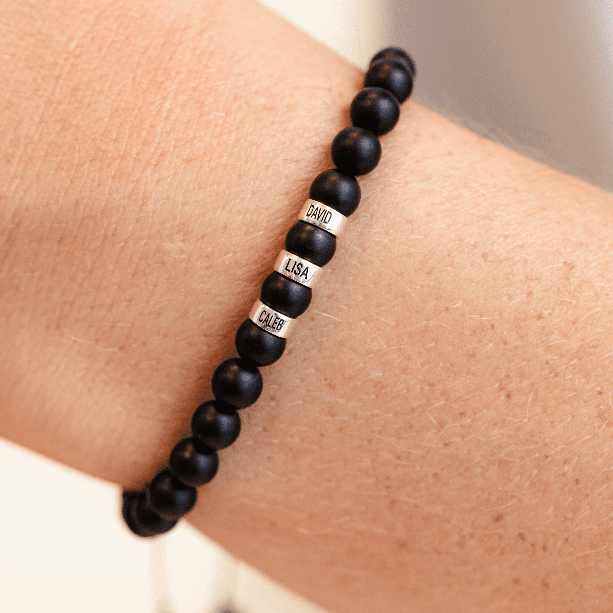 Movado | Men's Black Onyx Beaded Bracelet with Silver Signature Bead in Mixed metals/black